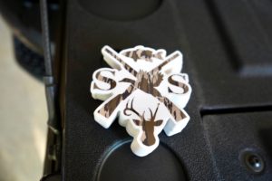 Stack of Sophie Swaney Logos in Camo